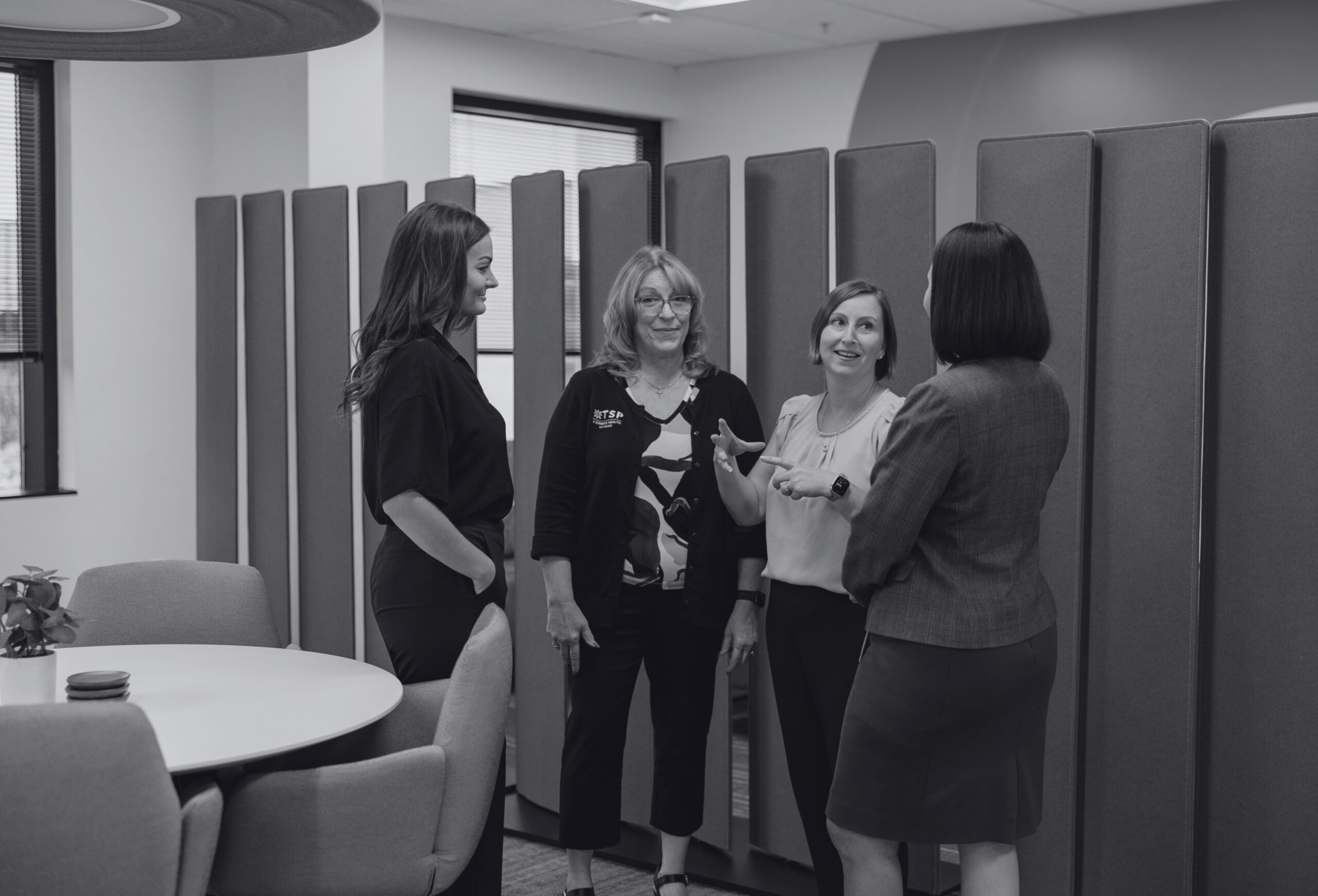 Woman shaking hands with her interviewer after interview.
